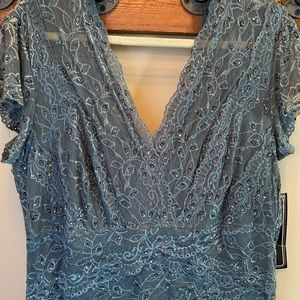 NWT cocktail length dress with lace and sequins.